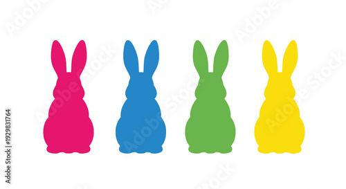 Four colorful rabbit silhouettes stand in a row representing spring and easter traditions a vibrant display of shapes silhouette