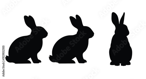 A minimalist depiction of three rabbits in varying poses rendered as a striking black silhouette high quality professional detailed