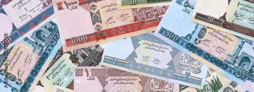 Obraz na plátně Afghan afghani money bills pile on table