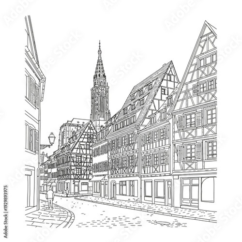 Traditional half-timbered houses in a European town with a church steeple.