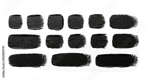 Collection of black brush strokes in various sizes and shapes.