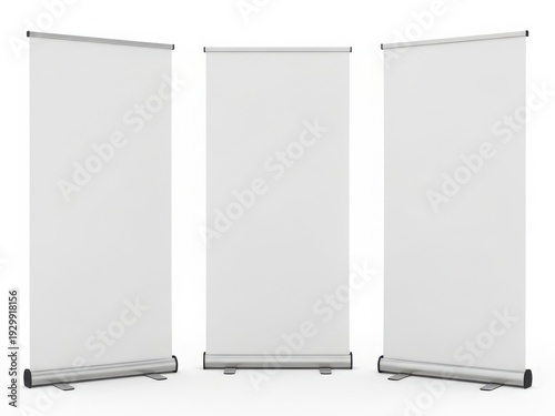 Three portable flip charts standing side by side with blank white boards.