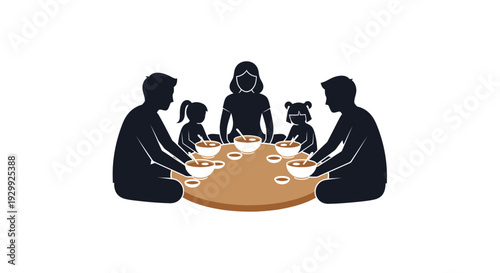 Family sharing a meal together with dogs.