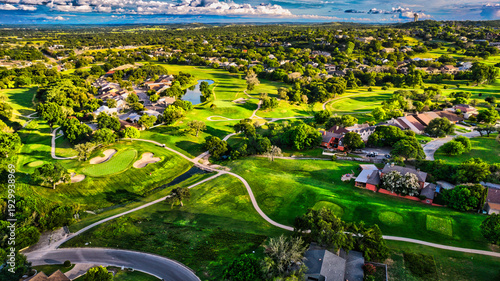 Aerial High Angle View of a Lush Green Golf Course and Residential Neighborhood