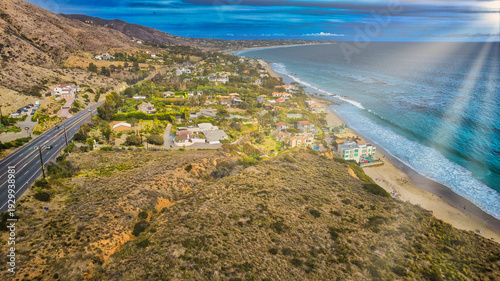 Aerial view of Malibu coastline with beach houses and Pacific Coast Highway