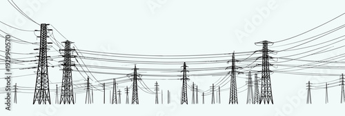 Power lines stand tall in a rural setting, connecting towers with cables. The scene shows transmission lines under clear skies.