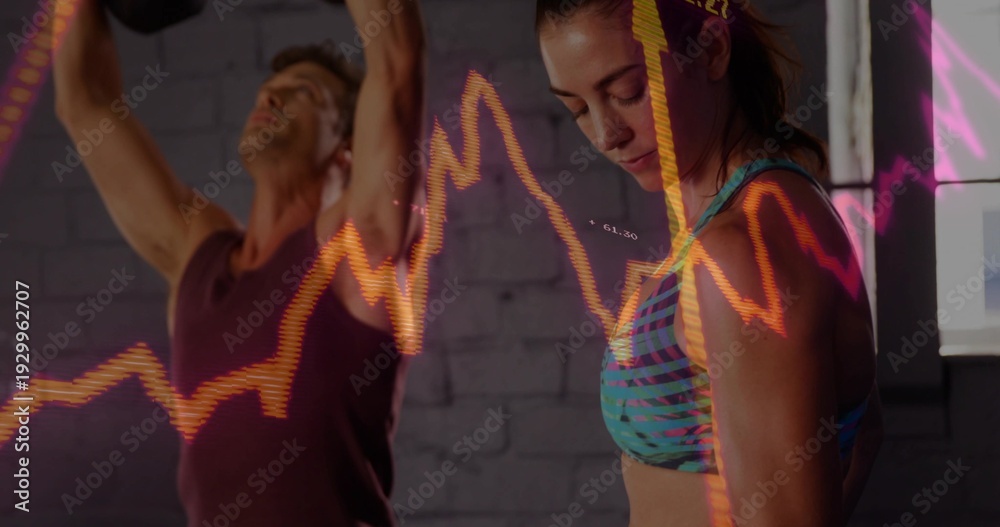 Obraz premium Stretching two adults in patterned teal bra and dark tank in studio with orange-pink line-chart