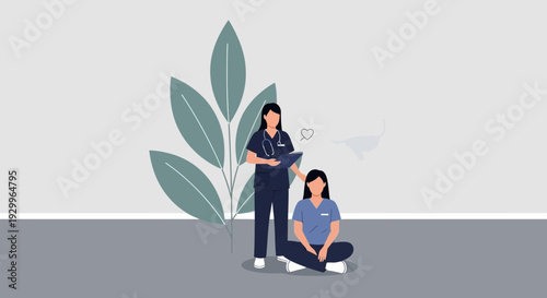 Two female medical professionals in scrubs one standing one sitting.