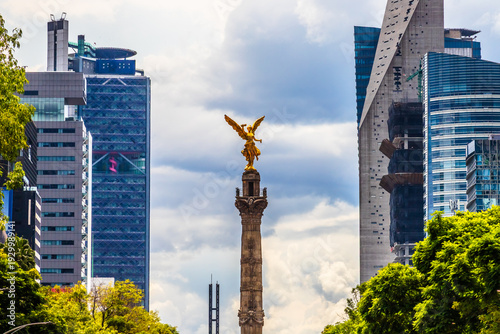 The Angel of Independence monument on Reforma Avenue in Mexico City under a cloudy sky
