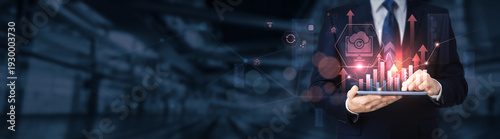 Businessman using a tablet for analyzing backup data and information, cloud storage, data recovery, cybersecurity, IT infrastructure, digital protection.