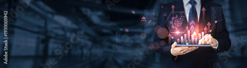 Fotografie Businessman using a tablet for analyzing digital transformation data and information, business innovation, technology adoption, process automation, enterprise modernization, IT strategy