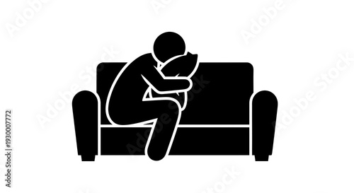 Person sitting on a couch holding their head in distress.