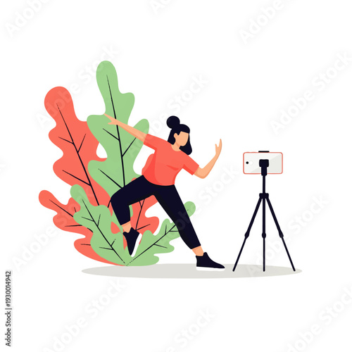 A woman in a dynamic pose records a video with her smartphone on a tripod in front of a colorful plant.