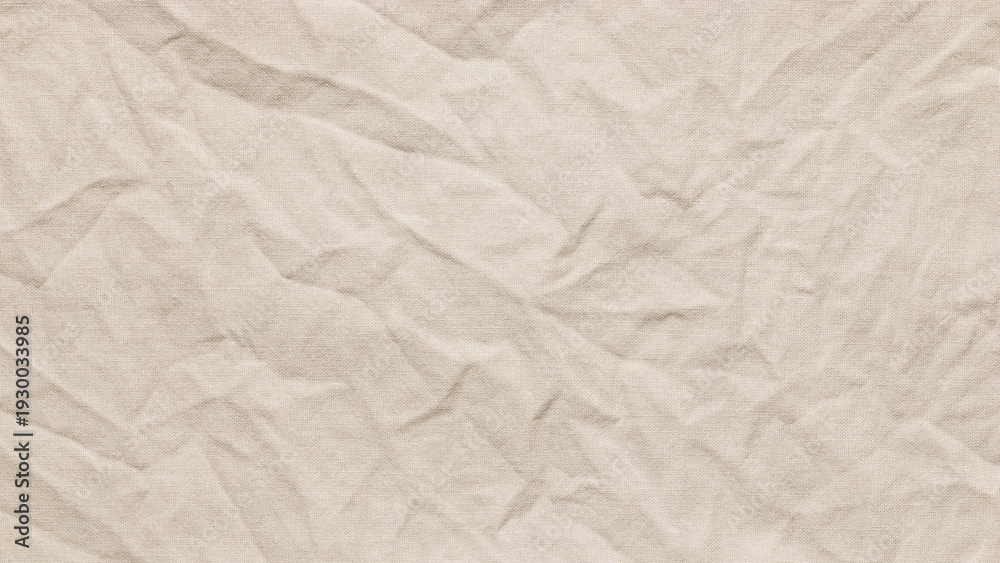 Obraz premium Crumpled ivory woven cotton texture, wrinkled textured light beige fabric with copy space