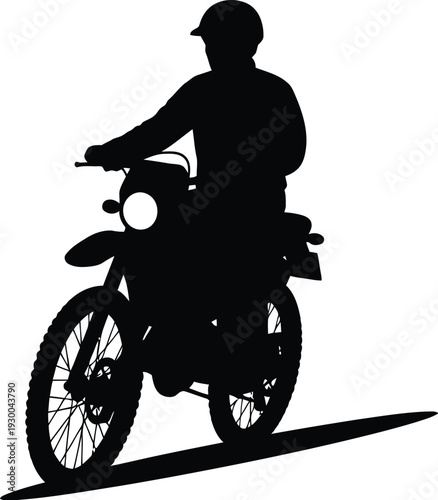 Silhouette of a motorcycle rider on an enduro bike, symbolizing adventure and speed