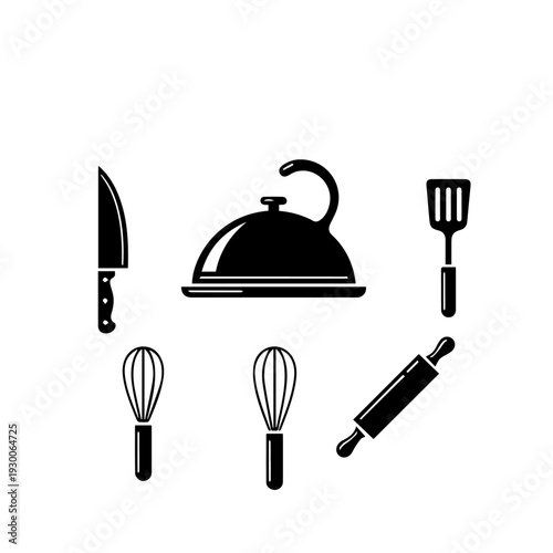 Kitchen utensils and cooking tools arranged neatly on a clean surface