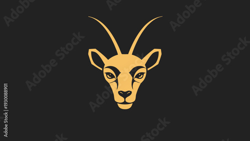 Golden Antelope Head Emblem on Dark Background.