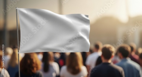 Blank white flag waving over a crowd of people outdoors