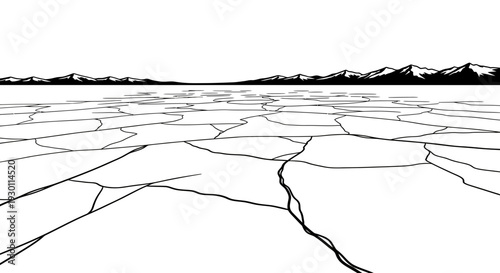 Expansive arid cracked earth leading towards a rugged distant mountain range under a vast sky