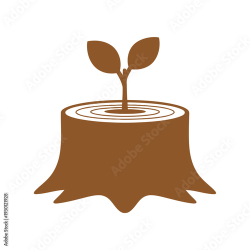Tree stump with sprout growing from rings