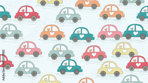 Cheerful seamless pattern of colorful small cars in various pastel shades decorated with small hearts on a light blue background.