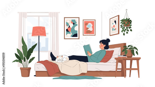 Young woman relaxes in her cozy bedroom reading a book while her white cat sleeps peacefully at the foot of the bed.