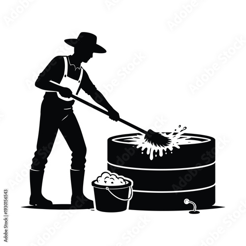 Man washing tire with brush and bucket