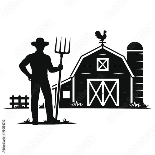 Farmer standing with pitchfork near barn silhouette