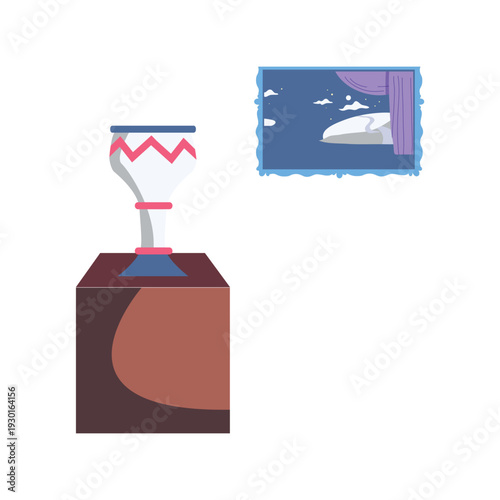 A trophy beside a framed picture of a boat, symbolizing achievement in boating or sailing.