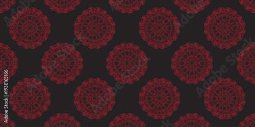Pattern of red circular ornaments on a dark background viewed from a straight-on perspective