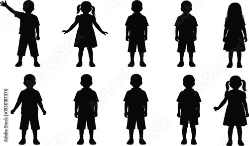 Set of ten diverse silhouettes of young school children standing in various poses and dresses isolated on a white background