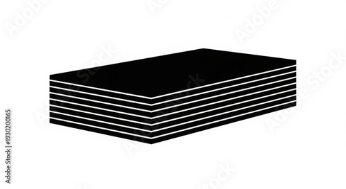 A stack of black rectangular objects viewed from a slight angle on a plain surface
