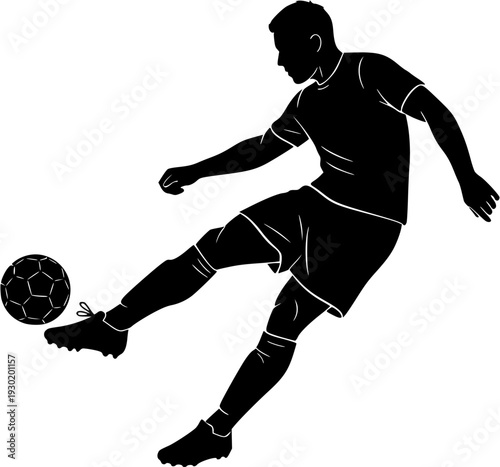 Silhouette of professional male soccer player kicking a football during a match action