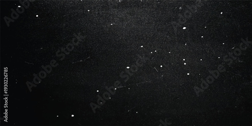 Rain drops on textured dark wall and window surface