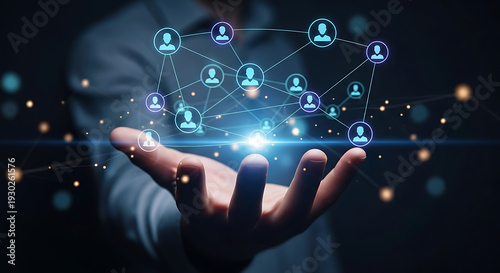 Hand holding a glowing digital network with connected people icons, symbolizing global business connections, social networking, and advanced technological communication for collaboration and outreach