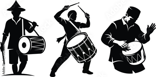 Silhouette of three drummers playing traditional drums