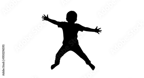 Silhouette of a jumping little boy.