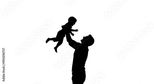 Silhouette of man holding baby.