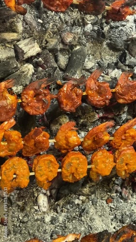 Shrimp skewers grilling over hot coals for a delicious seafood barbecue