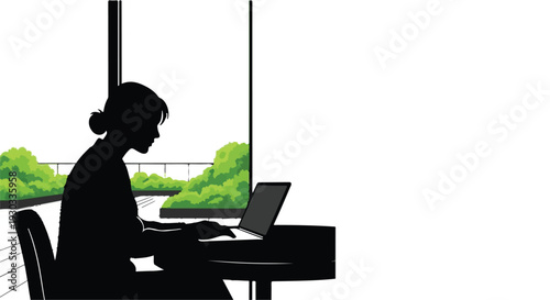 Silhouette of a woman focused on her laptop in a bright, modern office with a view of greenery.