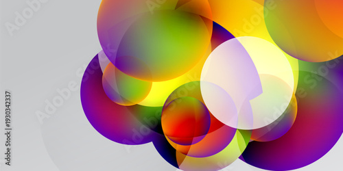 Abstract colorful circles overlap, creating vibrant gradients. Background transitions from black to white. Modern design element.