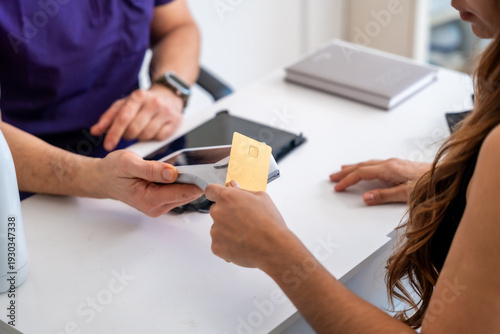 Patient making contactless payment for medical treatment