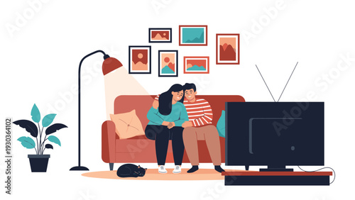Happy young couple sitting together on a red sofa and watching television in a cozy living room decorated with wall art and plants.
