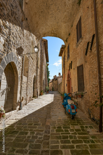A street among the old stone houses of Nocera Umbra, a medieval village in the Umbria region, Italy.