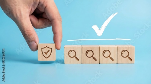 Wallpaper Mural A hand positions a wooden block featuring a shield icon next to blocks marked with magnifying glasses beneath a drawn checkmark indicating quality assurance. Torontodigital.ca