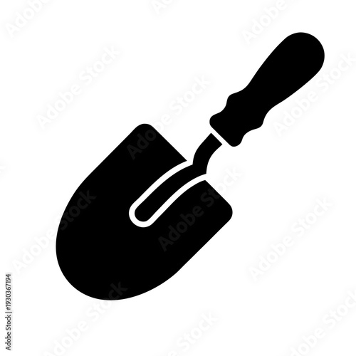 A black and white image of a trowel