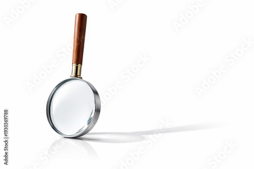 Studio product photo magnifying glass balanced upright on rim handle pointing up isolated on pure white seamless background
