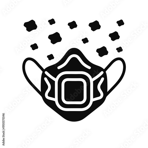 A black and white image of a face mask with particles