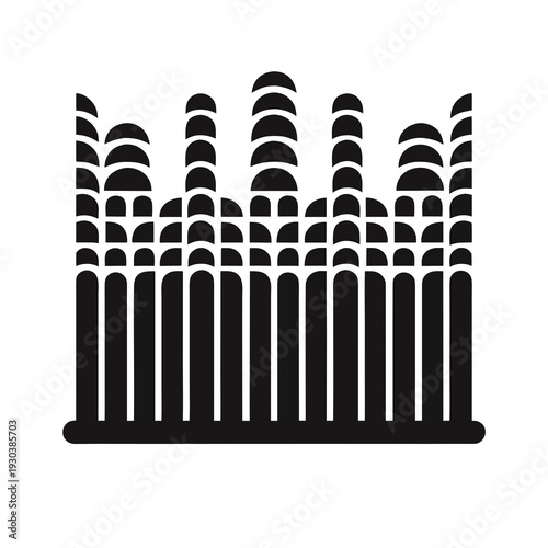 A black and white image of a fence with many spikes on top