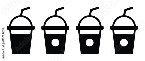 Four black of takeaway coffee cups with straws and lids